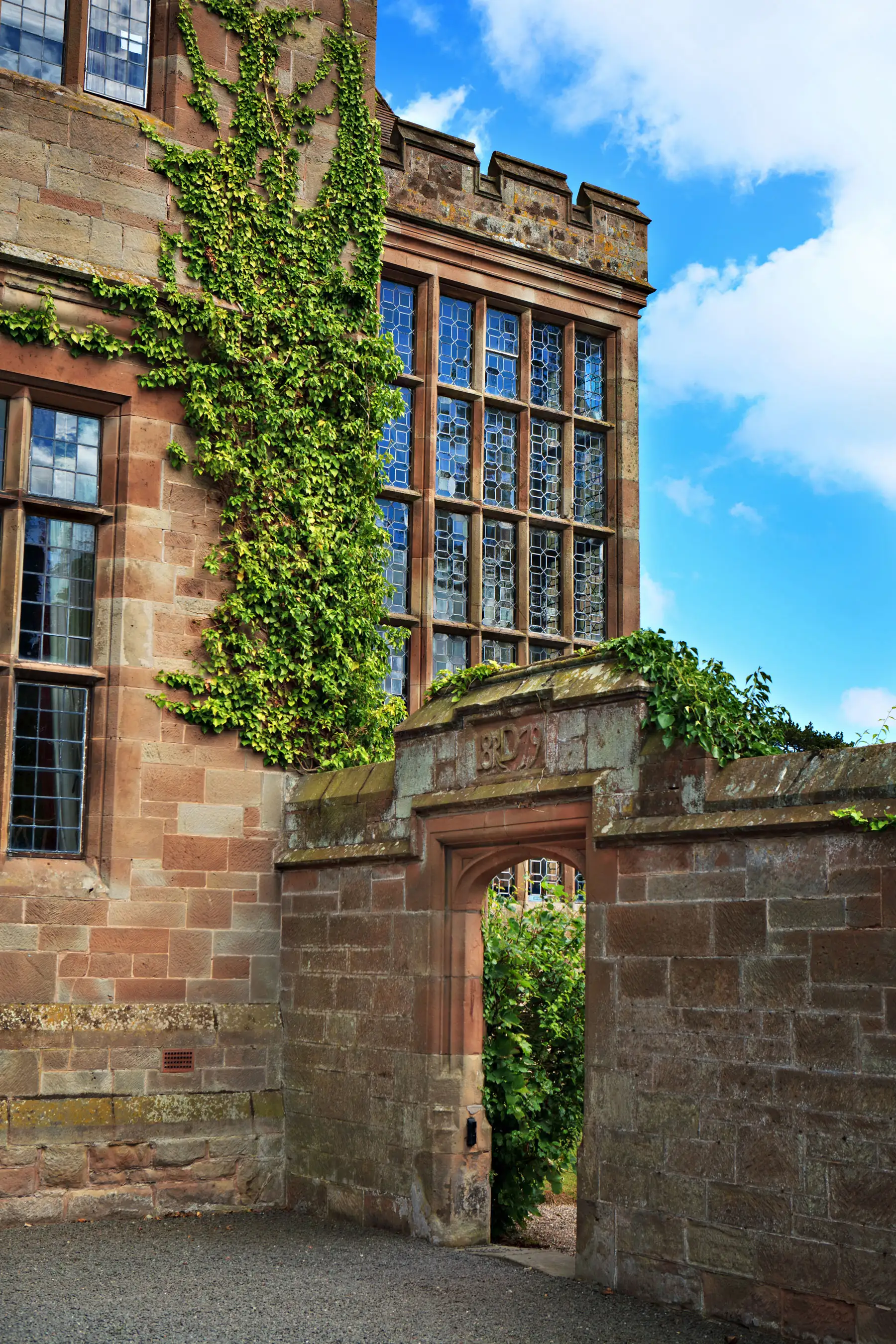 Adcote Hall exterior with ivy and traditional architecture